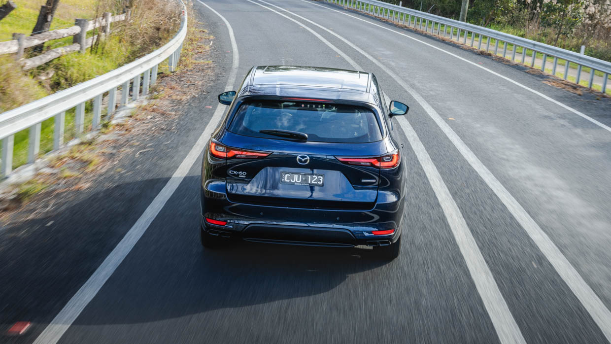 Mazda CX-60 P50E GT 2023 driving rear