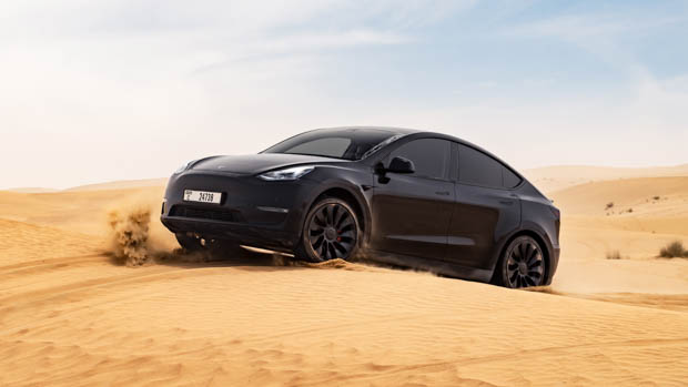 2023 Tesla Model Y driving in the desert