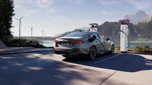 2024 BMW i5 plugged in at charging station CGI image