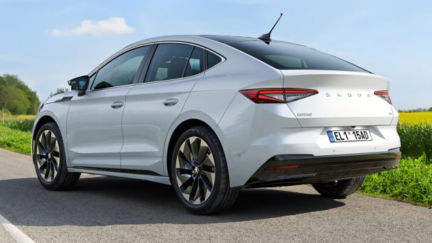 A white 2024 Skoda Enyaq 85 coupe painted in white in opposition to a blue sky