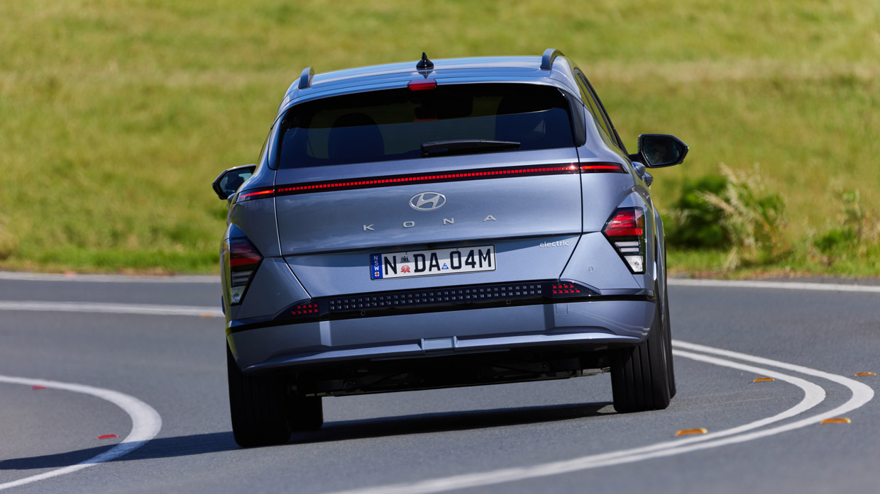Hyundai Kona Electric Premium 2024 driving rear