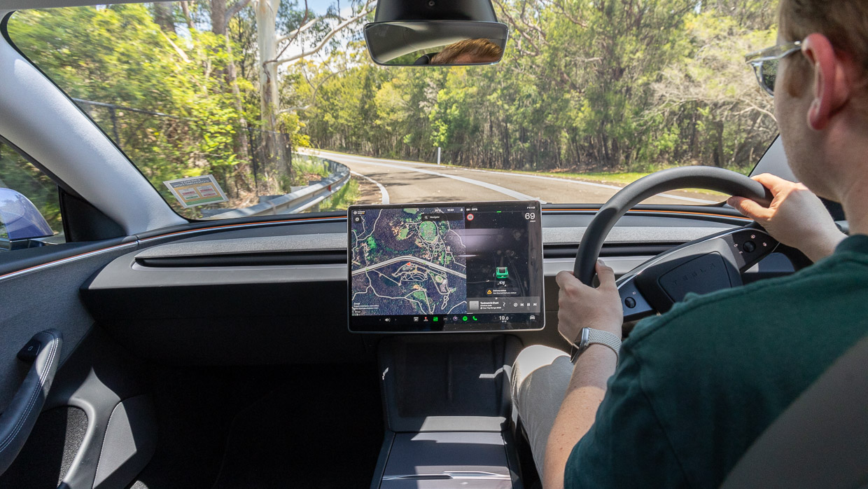 Tesla Model 3 RWD 2024 interior driving 2