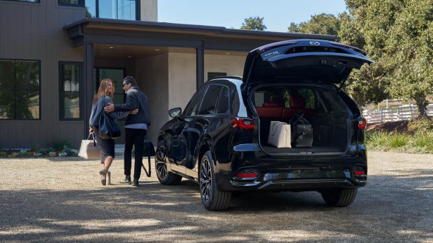 2024 Mazda CX-70 rear evaluate boot start with folk walking