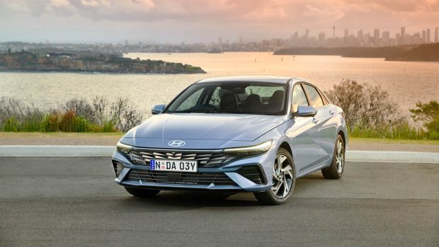 2024 Hyundai i30 Sedan Top rate entrance angle with Sydney in background