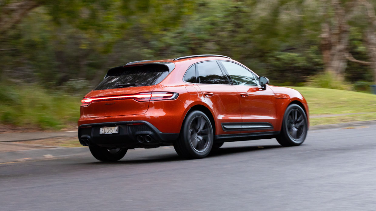 Porsche Macan T 2024 driving rear 2