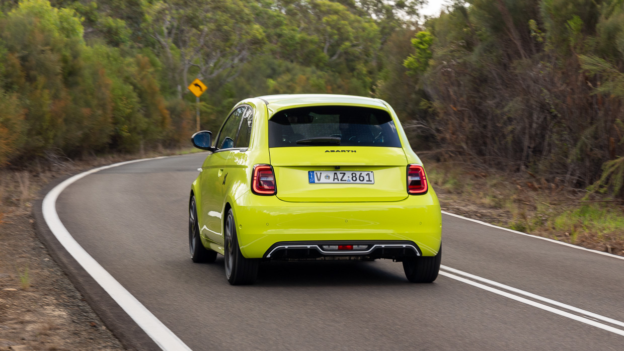 Abarth 500e 2024 driving rear