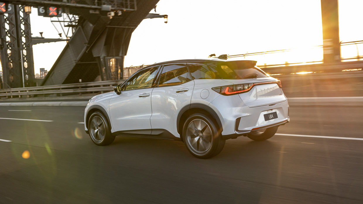 Lexus LBX 2024 driving rear 3/4 2