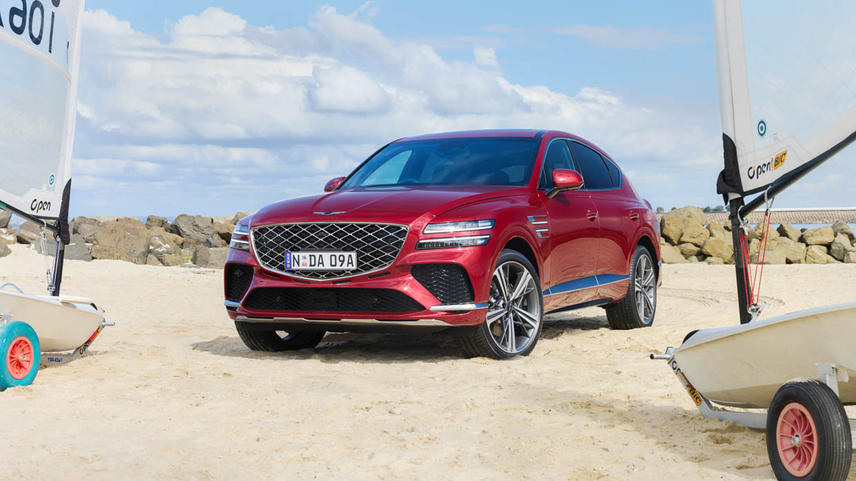 2025 Genesis GV80 Coupe red front 3/4 at the beach 2