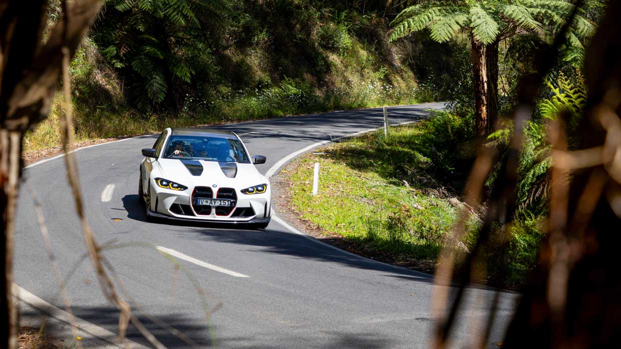 BMW M3 CS 2024 driving front 3/4 2