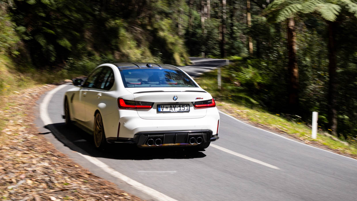 BMW M3 CS 2024 driving rear 3/4 2