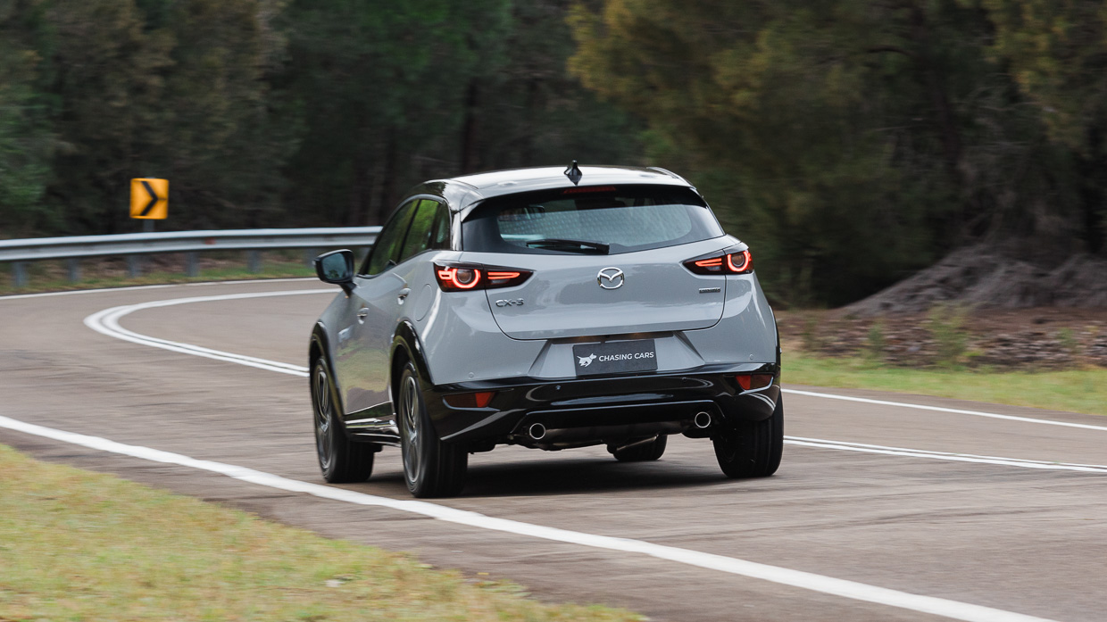 Mazda CX-3 Touring SP 2024 driving rear