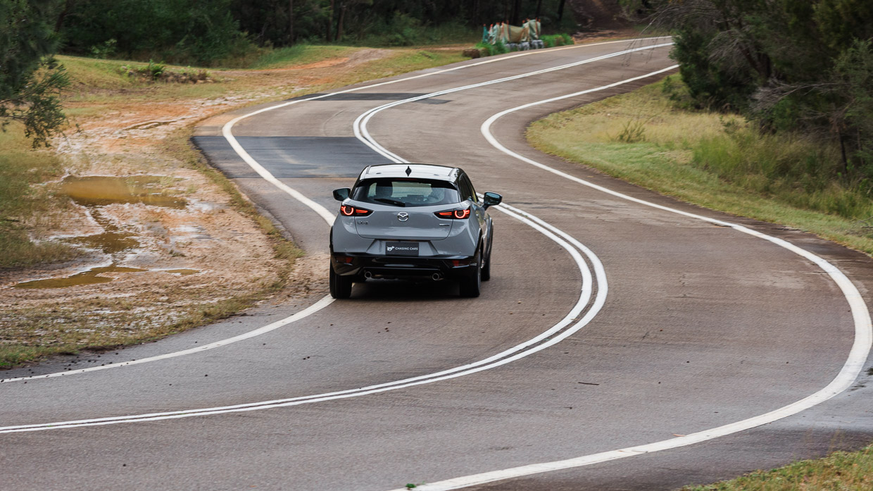 Mazda CX-3 Touring SP 2024 driving rear 2