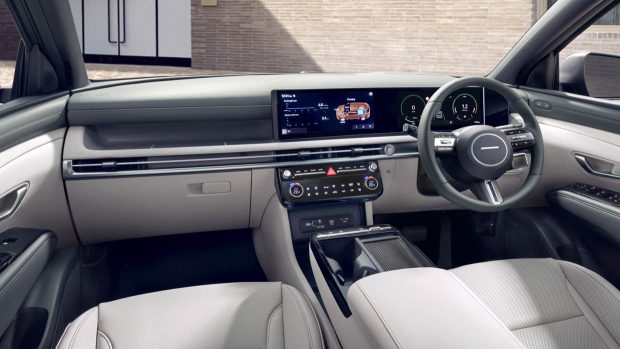 2025 Hyundai Tucson interior wide shot with screens and steering wheel