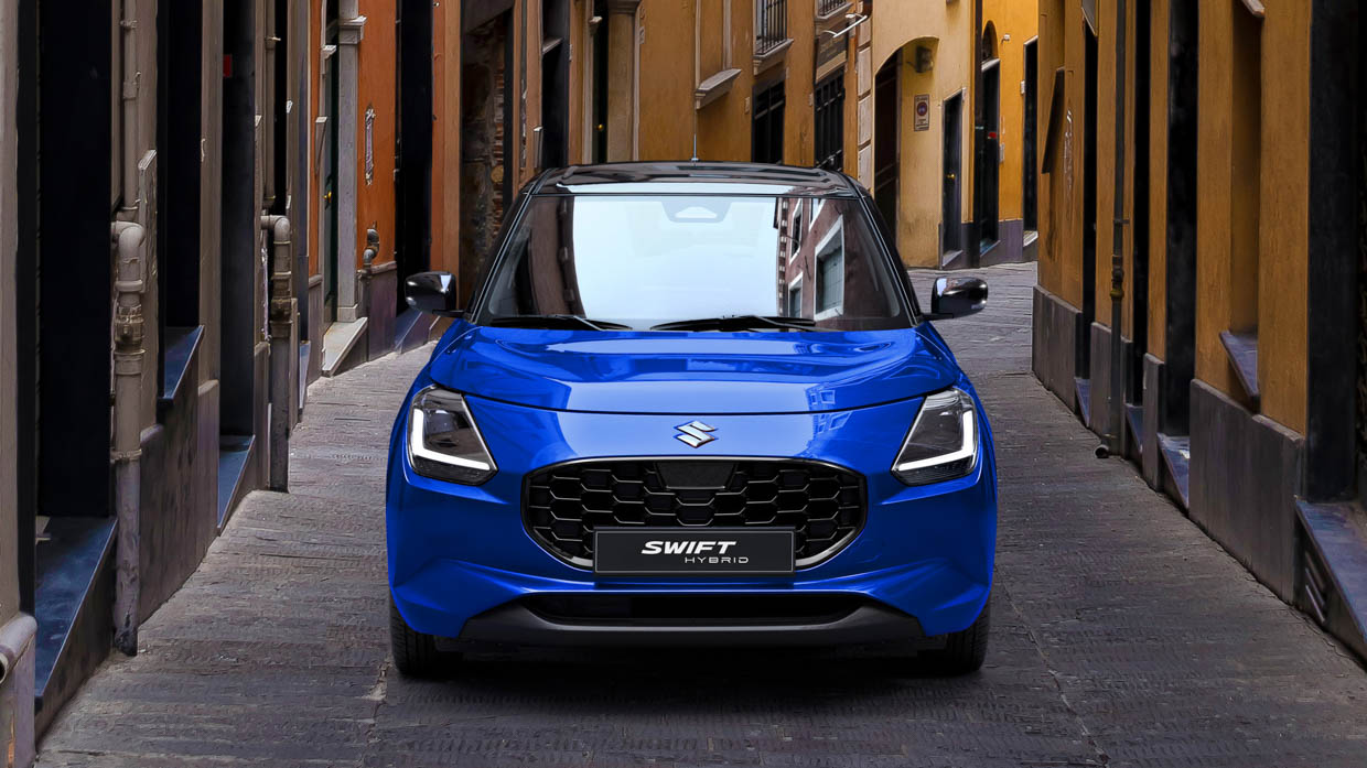 2024 Suzuki Swift blue front angle alleyway static shot