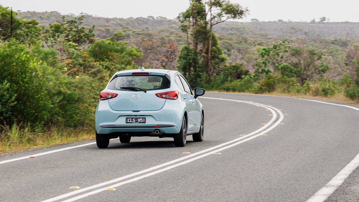 Mazda 2 GT 2024 driving rear