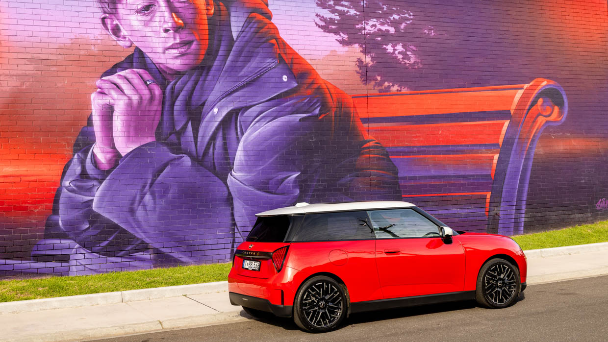 2024 Mini Cooper SE rear side angle with mural on wall