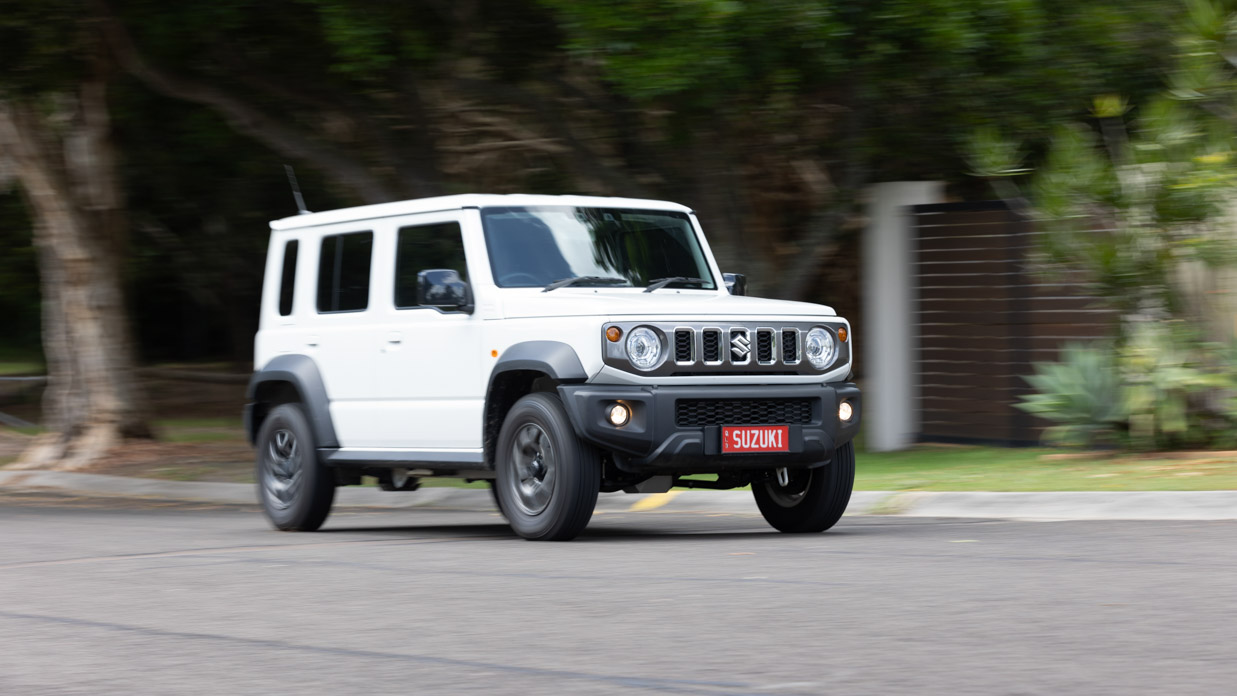 Suzuki Jimny XL 2024 driving street front 3/4