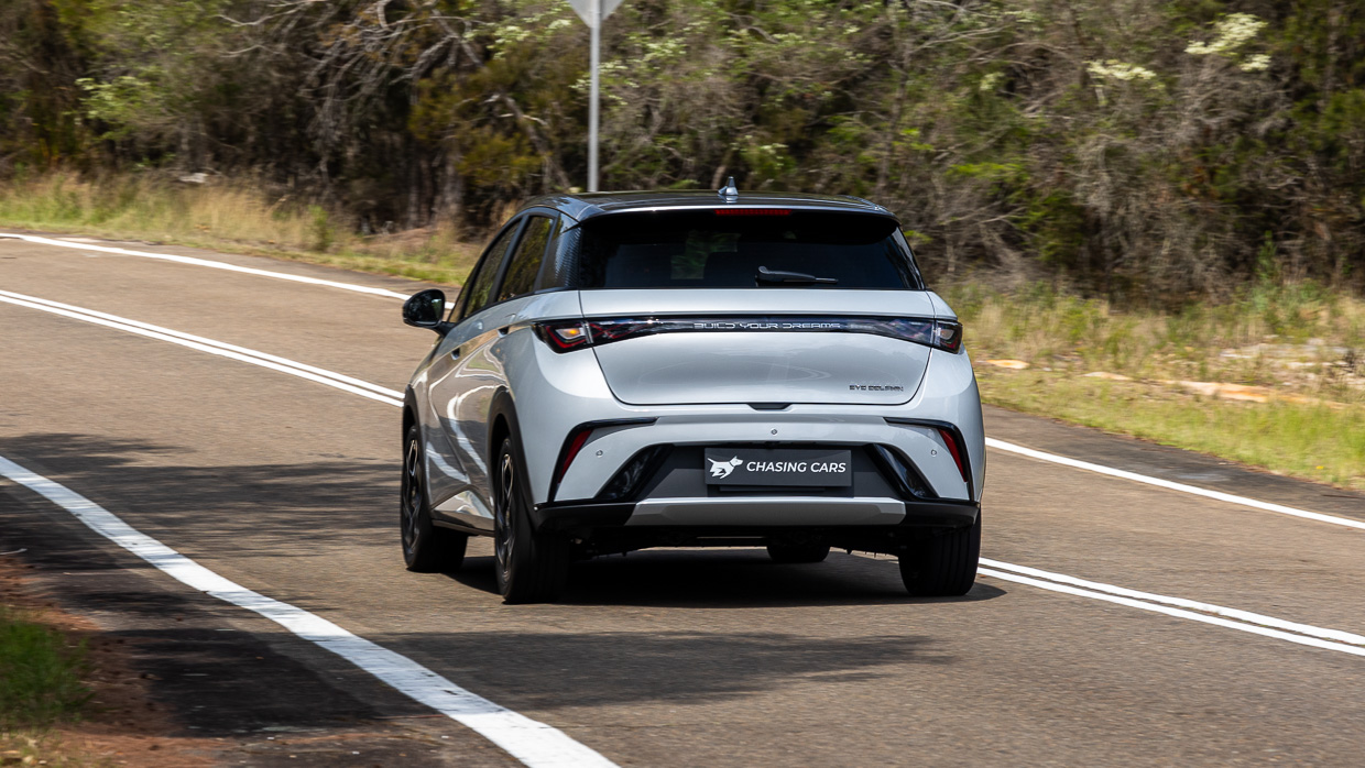 2024 BYD Dolphin Premium rear angle driving shot