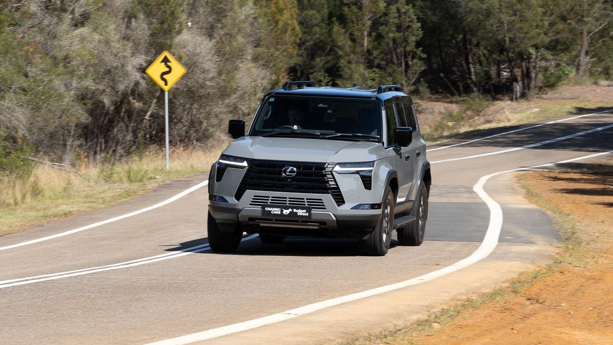 2024 Lexus GX550 Overtrail driving shot with sign HART