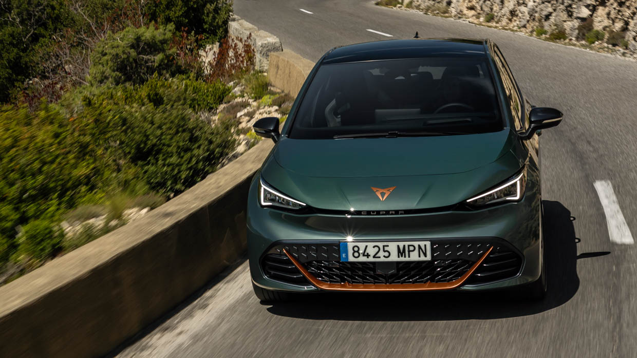 2024 Cupra Born VZ front angle driving shot mountain pass
