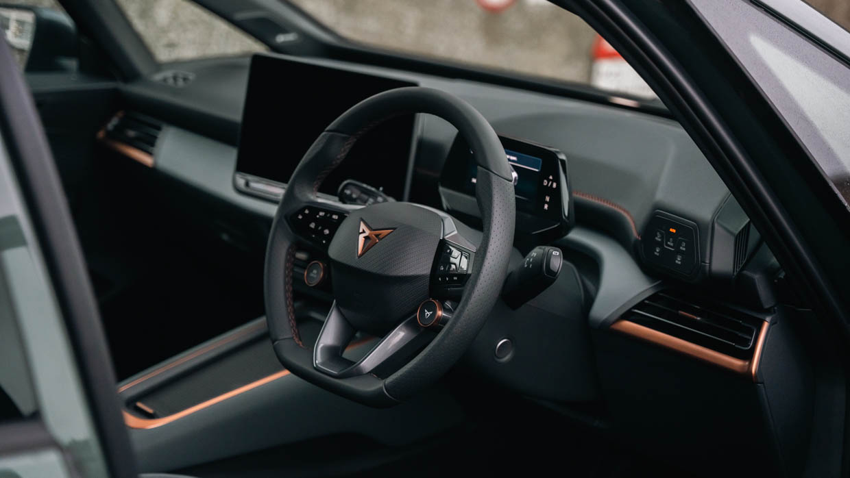 2024 Cupra Born VZ interior wide shot with steering wheel and screens