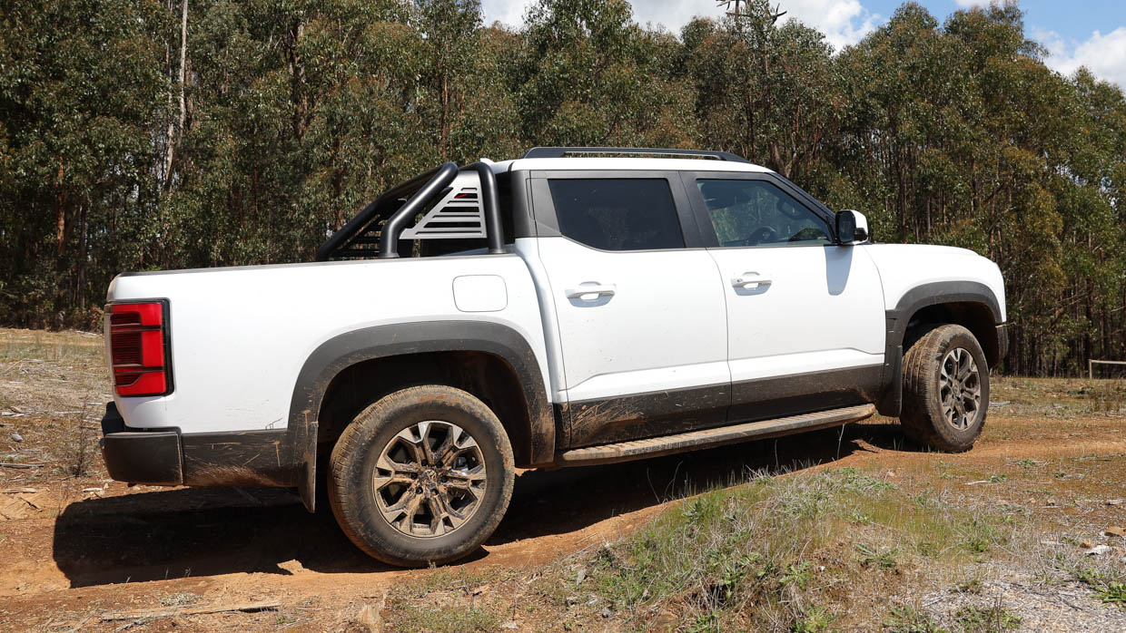 2025 BYD Shark 6 white side angle off-road