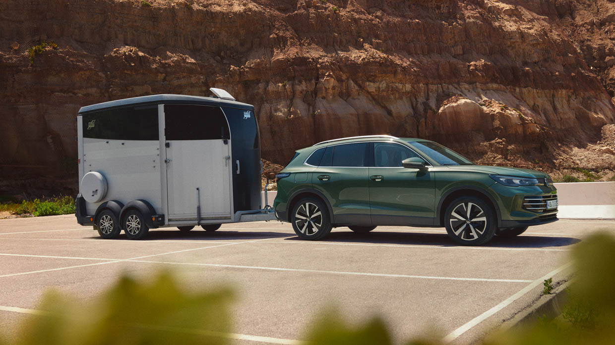 2025 Volkswagen Tiguan side angle with trailer