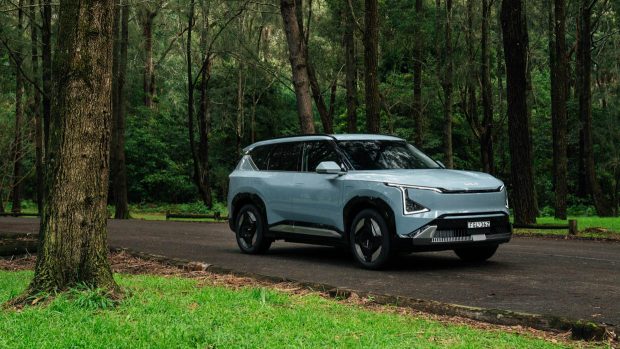 Car news today: Kia lobs pricing for its EV5 electric midsize SUV, Tesla goes all in with new autonomous Robocab, and more – 14 October 2024 6 2025 Kia EV5 entrance 3/4 wooded space shot