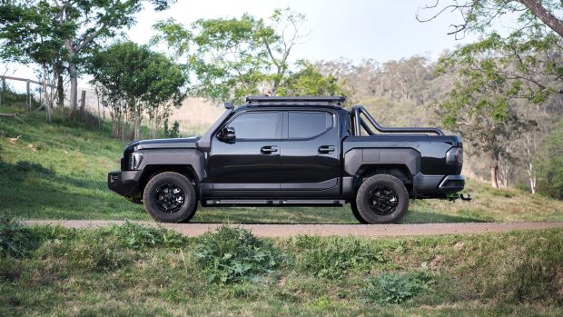 2025 Kia Tasman side attitude with sports bar