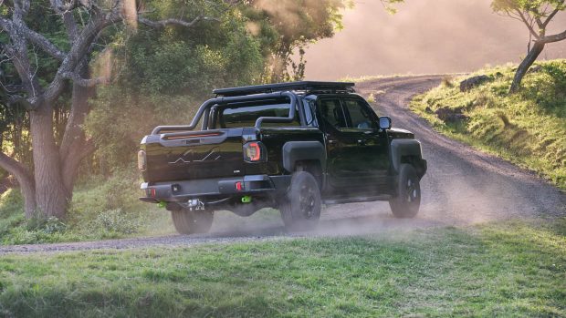 2025 Kia Tasman rear attitude riding dust shot