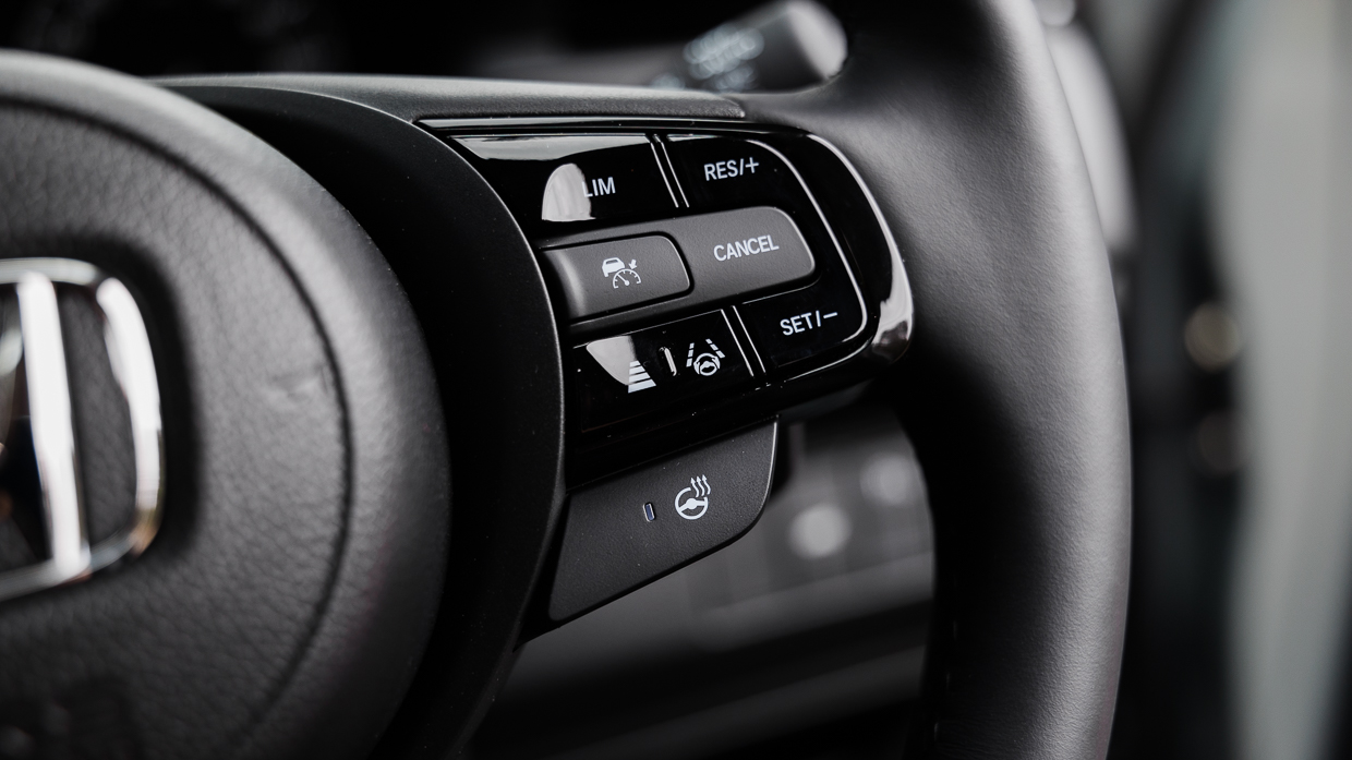 2024 Honda HR-V E:HEV L interior steering wheel buttons
