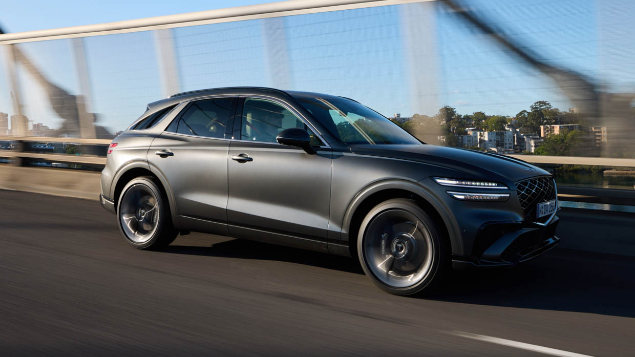 2025 Genesis GV70 Signature Sport side angle tracking shot