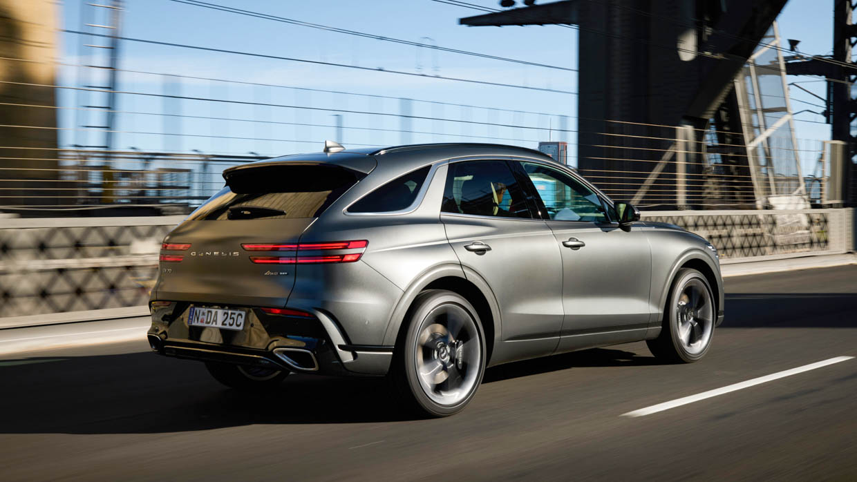 2025 Genesis GV70 Signature Sport rear angle tracking shot 2