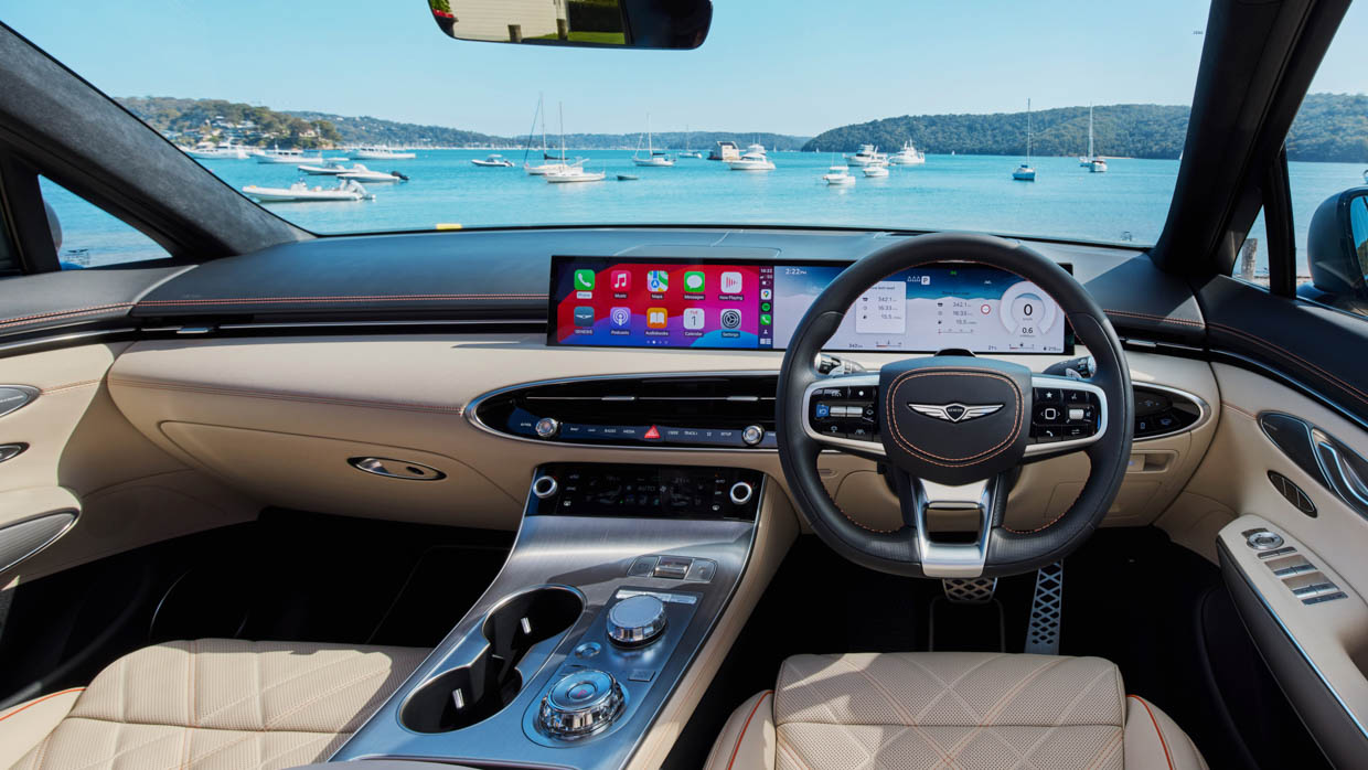 2025 Genesis GV70 Signature Sport interior wide shot with water background