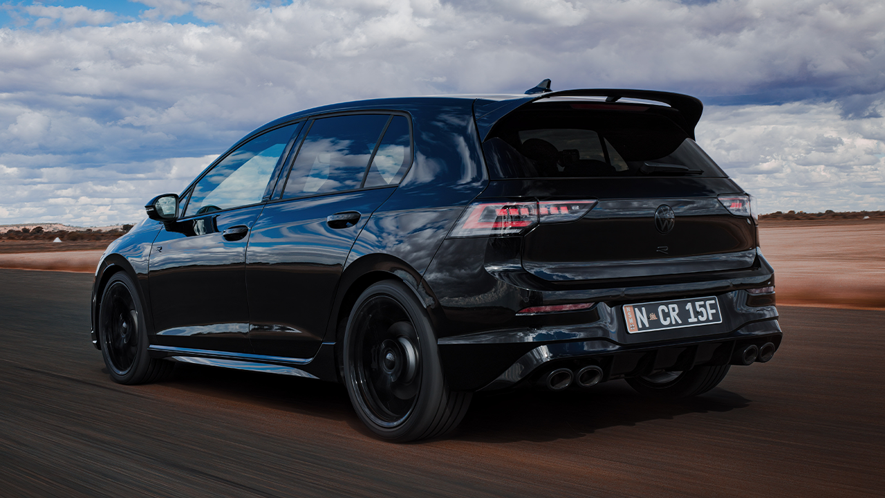 2025 Volkswagen Golf R black rear 3 4 driving